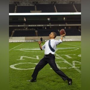 8x10 President Barack Obama throws a football at Soldier Field Photo